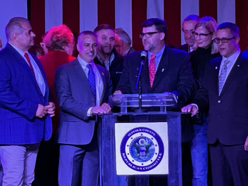 Jim Mazzarella, flanked by Republican Jesse Garcia (L), chairman of the Suffolk County Republican Party, and Michael Torres.